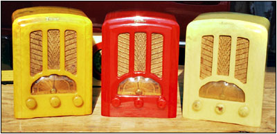 three Emerson AU-190s in yellow, red and cream