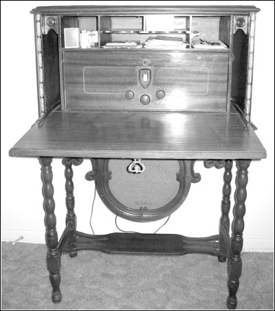 Pooley radio cabinet with the drop-front down showing the American Bosch Model 28 installed