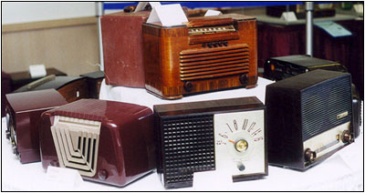 An assortment of 1940s and 1950s wood and plastic table radios