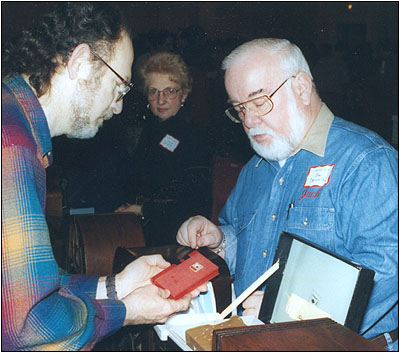 John DeLoria with a customer